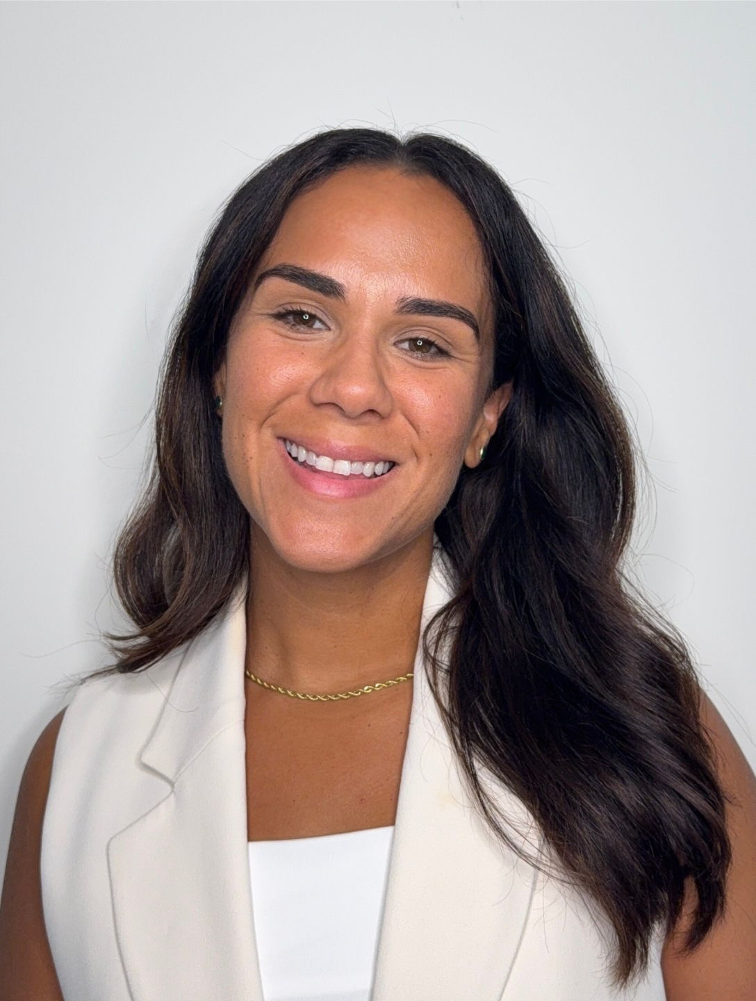 Dr. Sarah Kamille, founder, in warm natural light